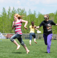 InMotion activities Girls playing in a field