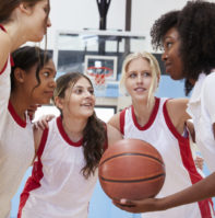 Girls playing basketball Female-only athletic education