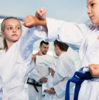 Girls in karate class Girls practicing new karate moves during class