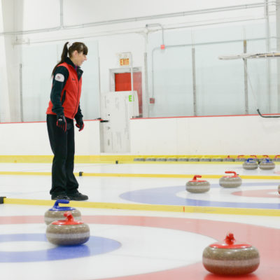 Curling coach on the ice