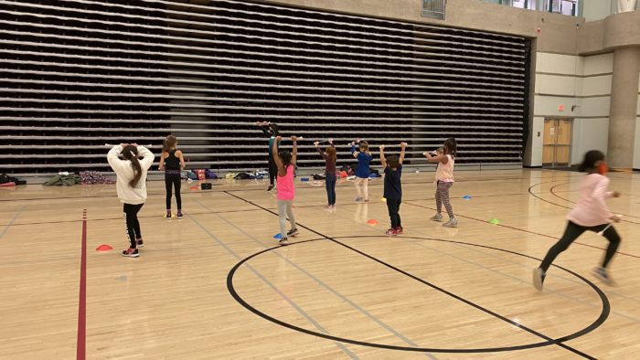 girls baton twirling in gymansium