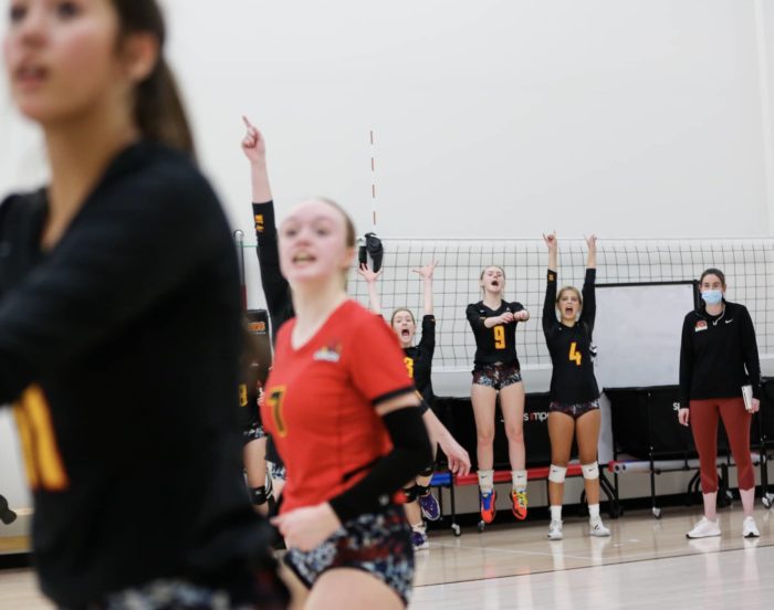 Girls team playing volleyball