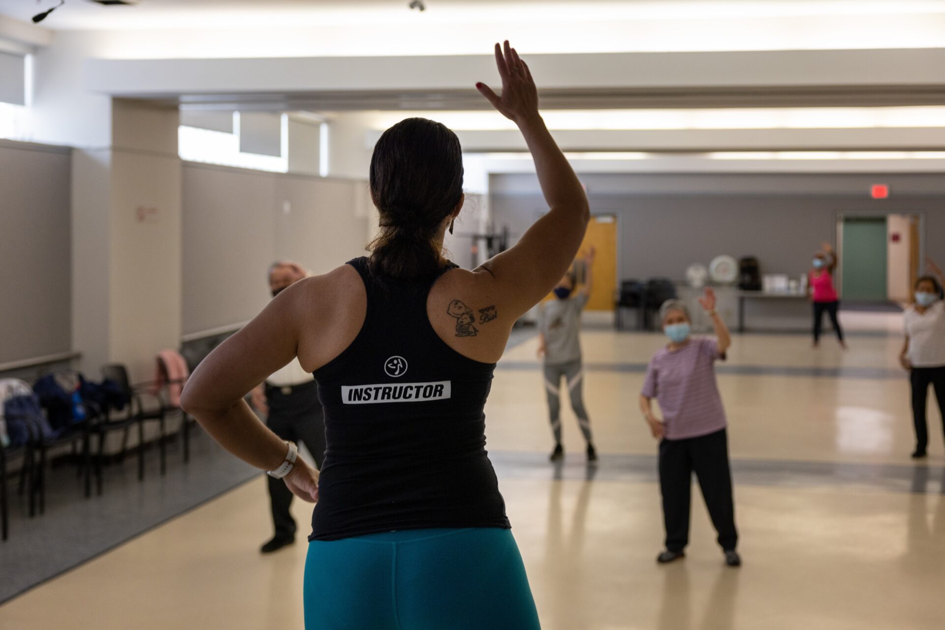 Zumba instructor leading seniors in activity.