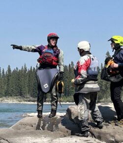 AB Whitewater women Coach leading 2 women